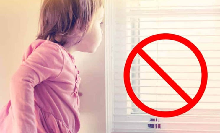 Child near blinds - from windowcoverings.org