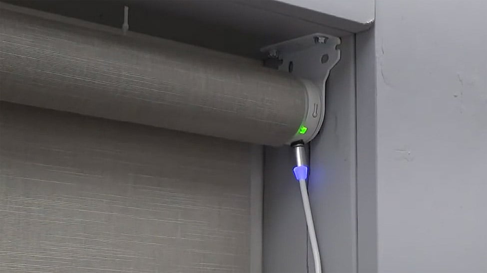 Motorized roller shade charging