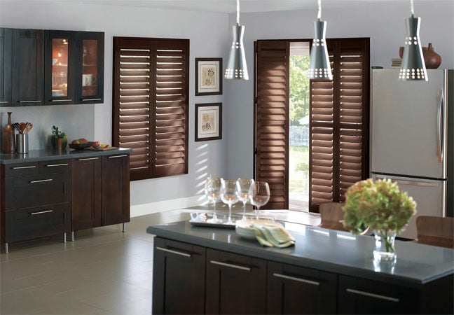 Stained wood shutters in kitchen