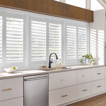 White faux wood shutters in a kitchen