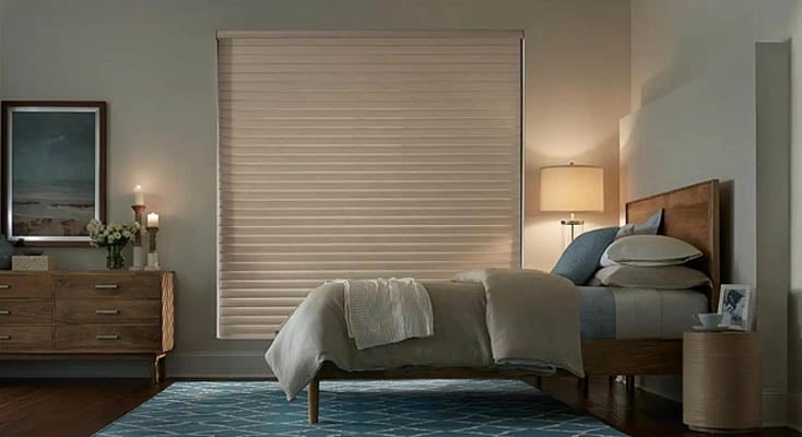 Blackout window shade in a bedroom