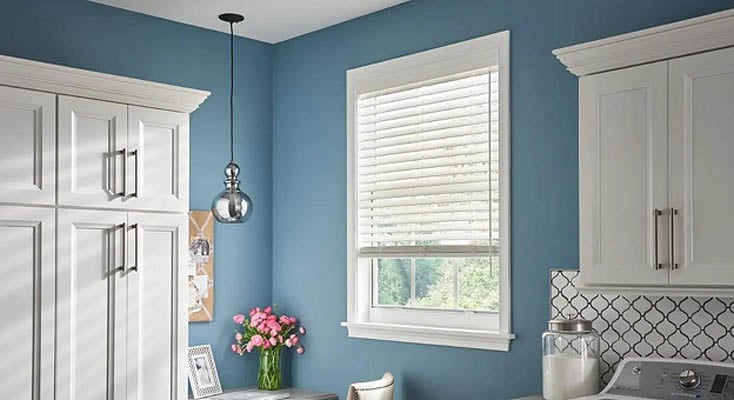 Faux wood blinds in a laundry room