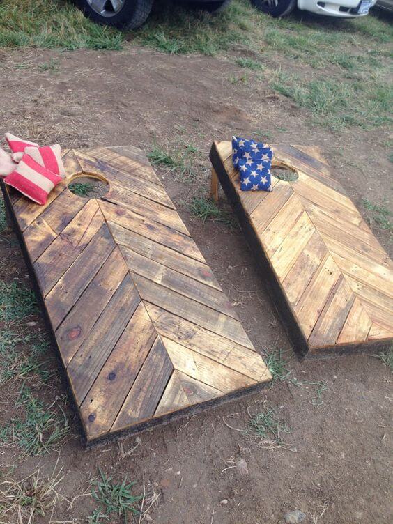 Create an outdoor game area with horseshoes and cornhole boards.